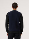 Back view of a model wearing a Navy Wool Fleece Zip Waistcoat. The waistcoat is navy blue wool, styled on a white background.
