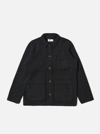 The Black Wool Fleece Field Jacket, made of black wool fleece, is laid flat on a white background. It features a collared neck, button closure, and multiple pockets.