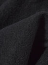 Close-up of the Black Wool Fleece Field Jacket, showing the texture and color of the wool fleece material. The jacket is displayed on a plain background.