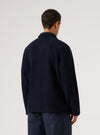 Back view of a model wearing the Navy Wool Fleece Field Jacket. The jacket is a dark navy color and made of a wool fleece material. The background is a plain white.