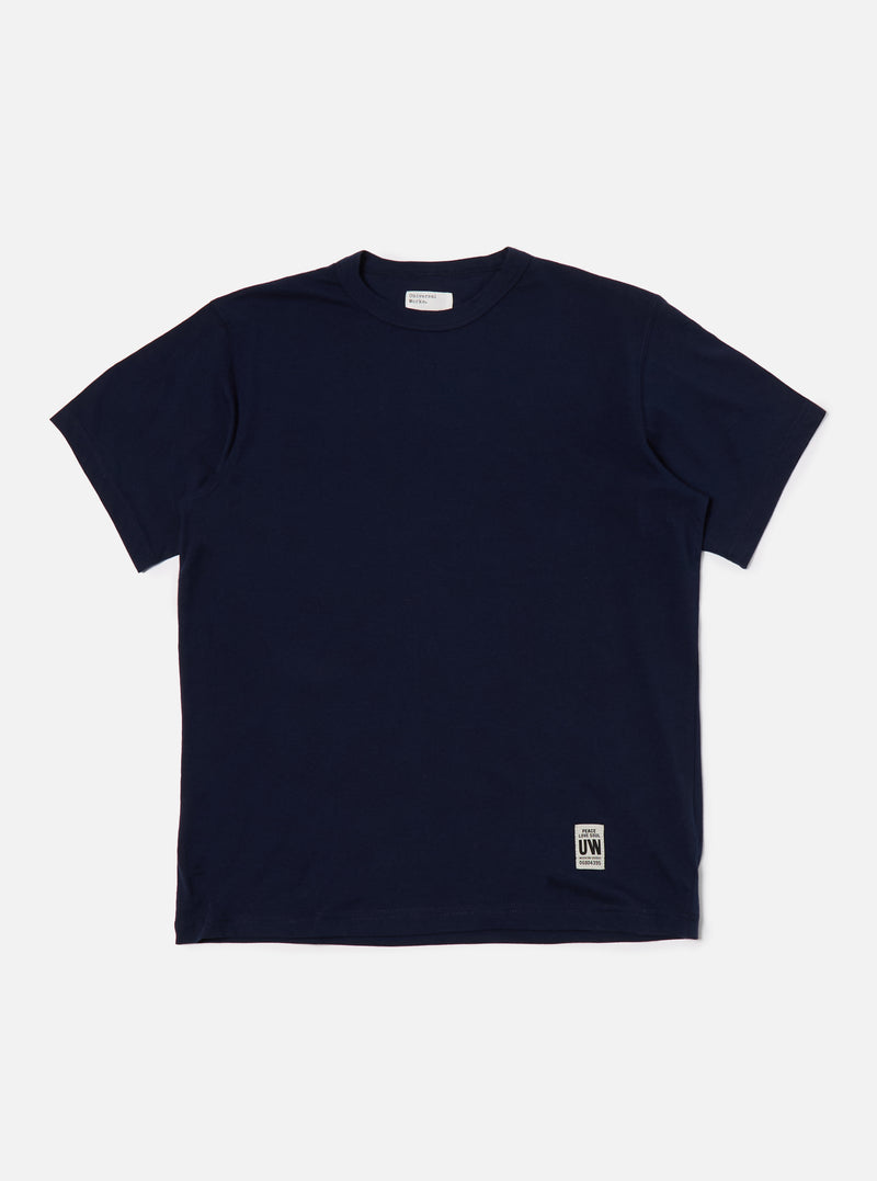 The Navy Single Jersey Core Tee is displayed on a white background. The tee is a dark navy color and appears to be made of a soft, single jersey material. 