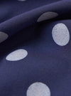 Close-up of the Navy Bold Dot Print Rayon Scout Scarf, showing the fabric's texture and the bold white polka dot pattern on the navy background.