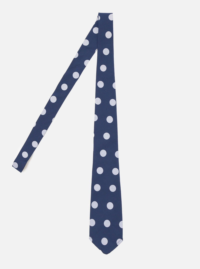 The Navy Bold Dot Print Rayon Tie is displayed on a white background. The tie is navy with white dots. The tie is made of rayon.