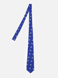 The Blue Bold Dot Print Rayon Tie is shown as a flat lay against a white background. The tie features a repeating pattern of white asymmetric polka dots on a blue base. The garment has a standard pointed tip and a smooth, matte finish.