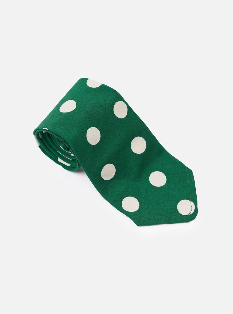 The Forest Green Bold Dot Print Rayon Tie is shown from a rear view as a flat lay against a plain white background. The image highlights the construction of the tie, including the keeper loop and the tipped ends, showcasing the forest green fabric with a white bold dot print.