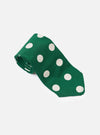 The Forest Green Bold Dot Print Rayon Tie is shown from a rear view as a flat lay against a plain white background. The image highlights the construction of the tie, including the keeper loop and the tipped ends, showcasing the forest green fabric with a white bold dot print.