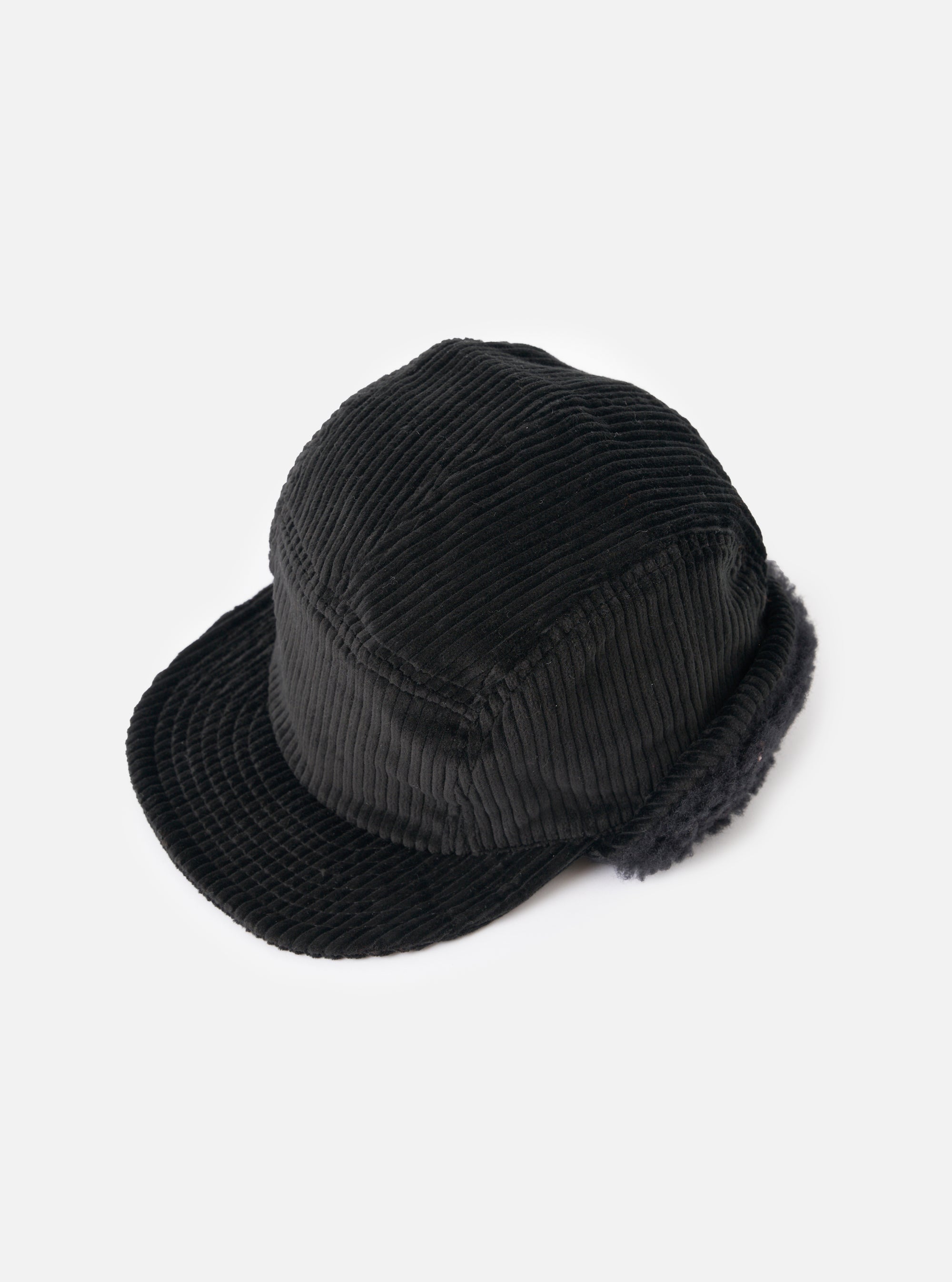 cableami® Black Corduroy 5w Cap on a white surface. The cap is made of black corduroy material and has a classic fit. The background is clean and minimal.