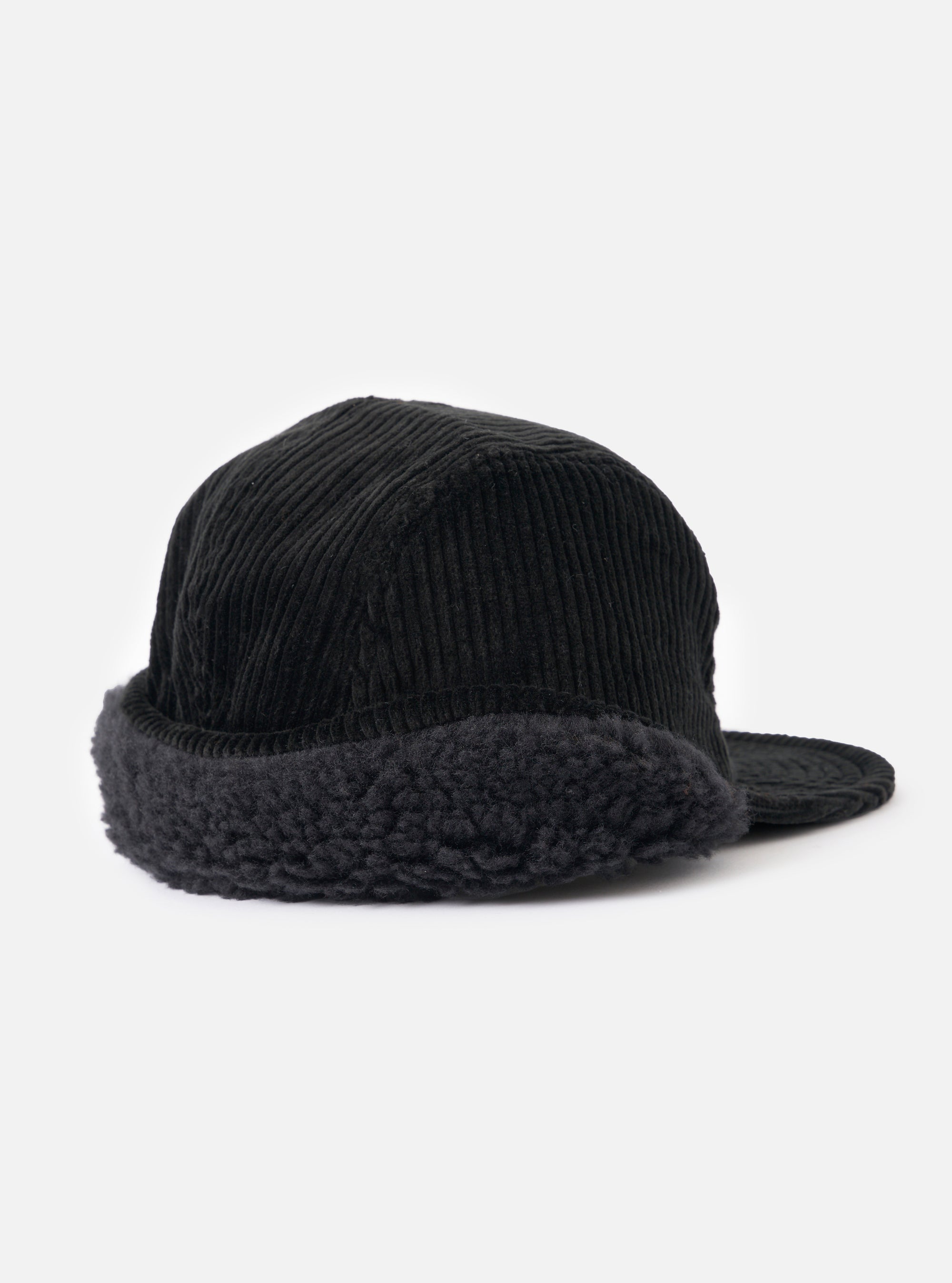 cableami® Black Corduroy 5w Cap on a white backdrop. The cap features a corduroy texture and a furry trim, offering a snug fit.