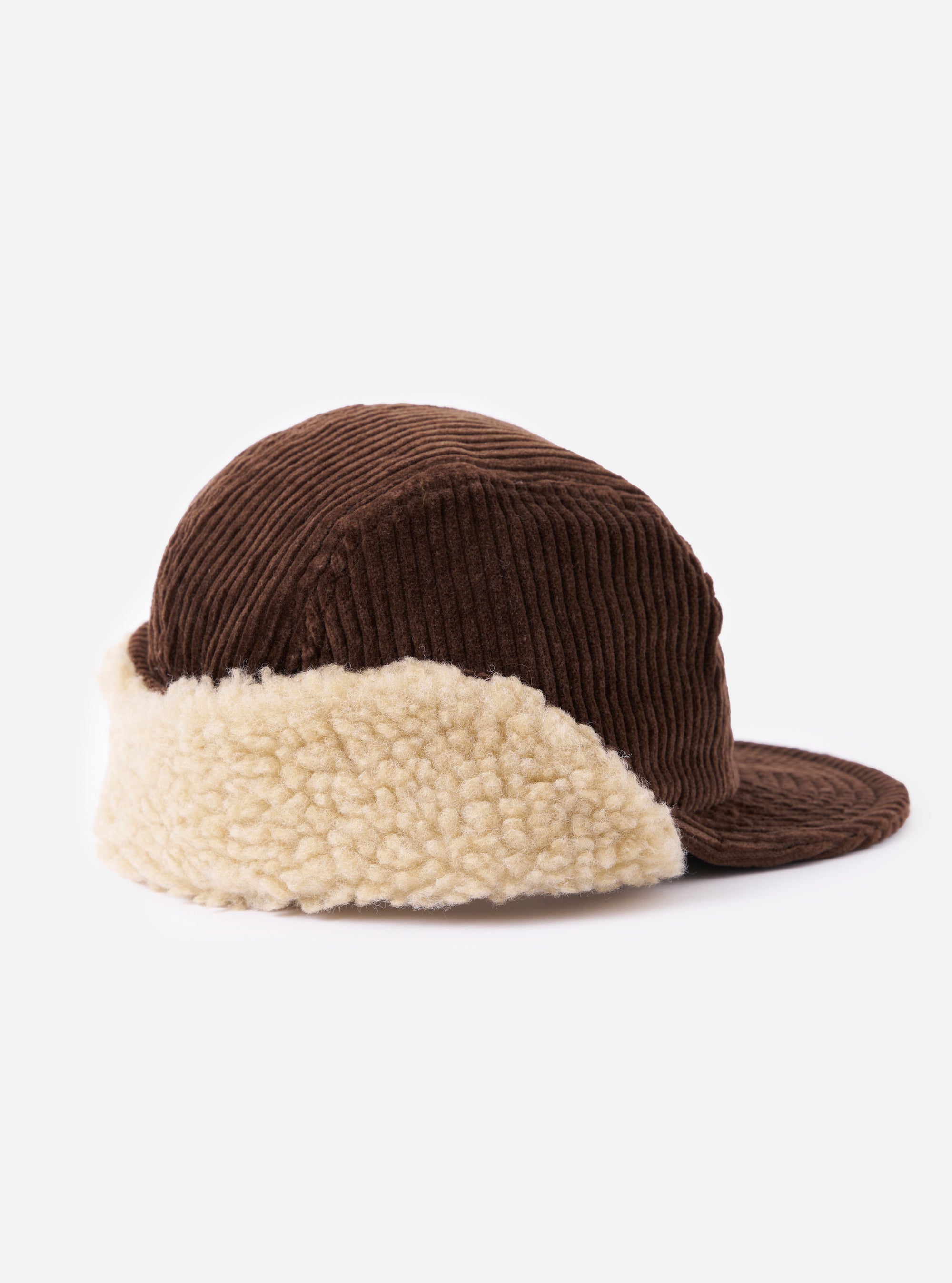 cableami® Brown Corduroy 5w Cap on a white background. The cap is brown corduroy with a cream-colored faux fur trim. The cap has a classic, comfortable fit.
