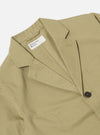 Close-up of the Sand Twill London Jacket on a white background. The jacket is made of a sand-colored twill fabric and has a classic fit. The jacket is buttoned and has a label.