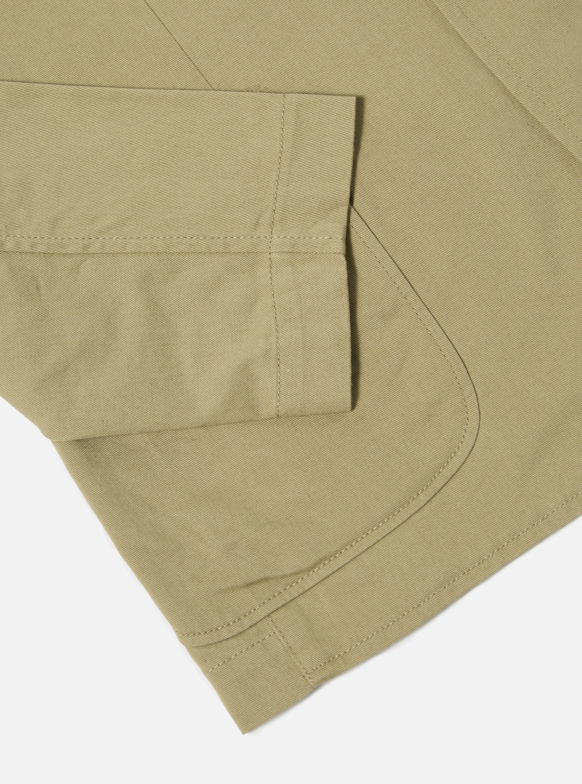 Close-up of the sand-colored twill fabric and tailored details of the Sand Twill London Jacket, displayed on a clean white surface.