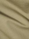 Close-up of the sand twill fabric of the London Jacket, showing the texture and color. The material is draped to highlight its quality.
