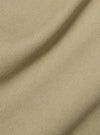 Close-up of the sand-colored twill fabric of the Sand Twill Bakers Jacket, showing texture and drape. Studio shot.