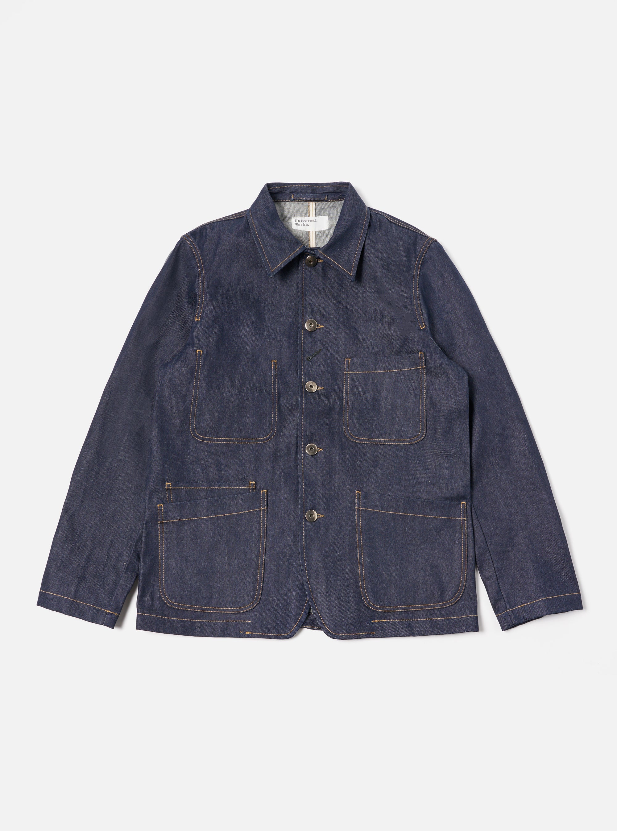The Indigo 13oz Selvedge Denim Bakers Jacket is displayed on a white background. The jacket is a dark wash denim with four front pockets and button closure.
