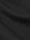 Close-up of the Black Twill Three Button Jacket fabric. The dark twill material is softly lit, showing the texture and weave of the fabric.