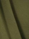 Close-up of the light olive twill Kyoto work jacket fabric. The twill weave is visible, showing the texture and color of the material.