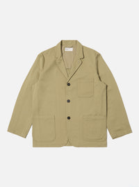 The Sand Twill Three Button Jacket is laid flat on a white background. The jacket is a light tan color and made of twill. It has three dark buttons and two large pockets.