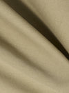 Close-up of the sand twill fabric of the Three Button Jacket. The material is draped to show texture and color. The background is a plain white surface.