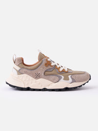 The Flower Mountain Light Brown Suede/Nylon Rulis Uni is shown as a side-profile studio shot against a plain white background. The sneaker features a light brown technical fabric base with overlapping multicolored suede panels in shades of brown, bordeaux, and lime. It has a white lace-up closure with reinforced eyelets, a webbing pull tab at the heel, and a molded, ultra-light rubber sole with a distinct indented tread.