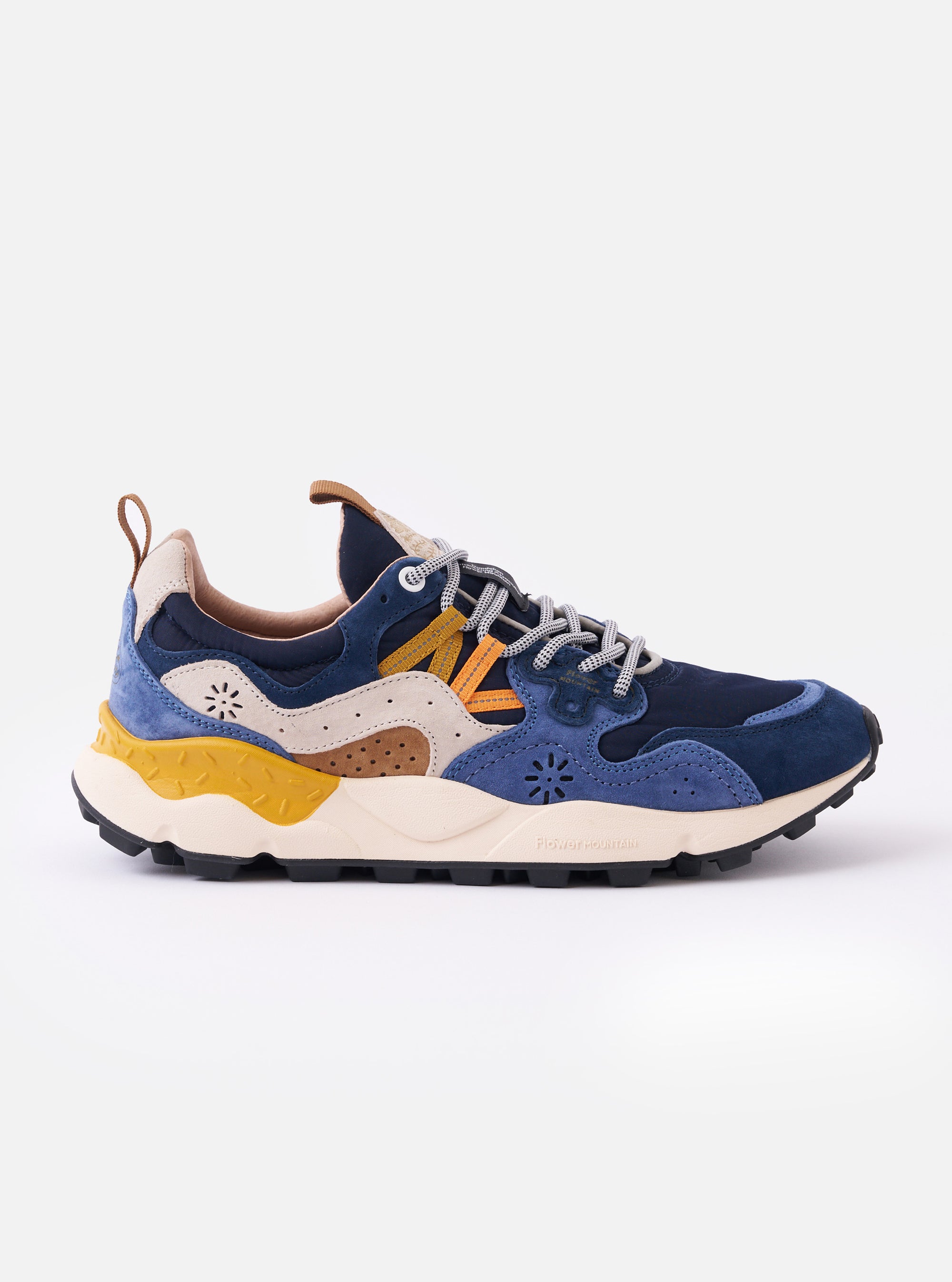 The Flower Mountain Navy/Light Navy Suede/Nylon Yamano 3 Man is shown as a side profile view against a plain white background. The sneaker features a layered upper with navy and light navy suede panels over a technical nylon base, highlighted by contrast stitching and a signature tape lacing system with leather eyelets. The shoe is finished with a natural cork insole and a thick, cream-colored rubber sole with a distinct notched tread.