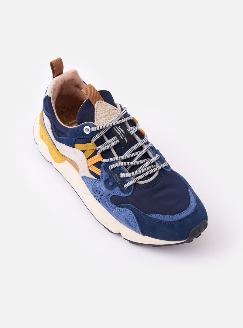 The Flower Mountain Navy/Light Navy Suede/Nylon Yamano 3 Man is shown from a side profile as a flat lay against a plain white background. The sneaker features a low-top silhouette with overlapping navy and light navy suede panels over a durable nylon base. Prominent details include the trekking-style laces, reinforced leather eyelets, and a thick, off-white midsole with a toothed rubber tread.