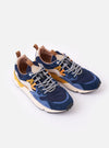 The Flower Mountain Navy/Light Navy Suede/Nylon Yamano 3 Man is shown as a flat lay against a white background. The sneaker features a technical fabric and suede upper in contrasting shades of navy, nature-inspired perforations, and a tape and lace system with trekking laces. The shoe is completed with a signature notched edge rubber gum sole and a webbing back pull tab.