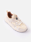 The Flower Mountain Milk/Light Beige Suede/Nylon Rulis Uni sneaker is shown from a side angle, highlighting its multi-textured upper featuring technical nylon and overlapping suede panels in shades of milk and light beige. The shoe features a thick, off-white midsole with a textured gum rubber outsole and white cotton laces. It is displayed as a standalone product against a plain white background with no model or mannequin present.