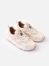 The Flower Mountain Milk/Light Beige Suede/Nylon Rulis Uni sneaker is shown in a detail view as a flat lay against a plain white background. The image highlights the layered construction of the footwear, featuring overlapping light beige suede panels and milky white technical fabric. The thick, moulded rubber sole with a textured sidewall and the webbing pull tab at the heel are prominent.
