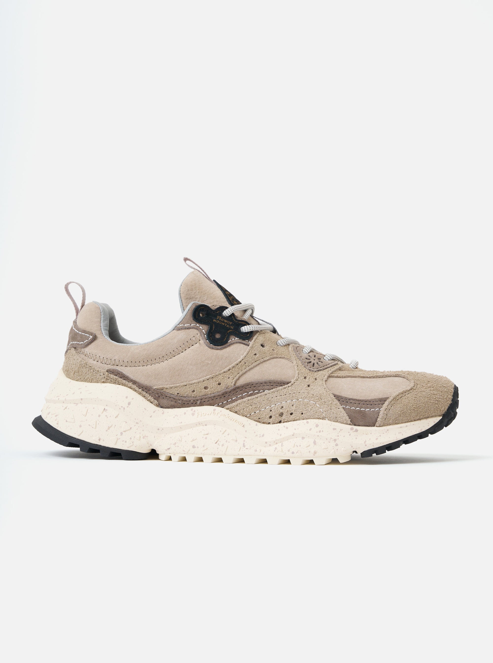 Side view of the Flower Mountain Dove Hairy Velour/Suede Wave Man sneaker. It's a beige shoe with suede and velour details, set against a white background.