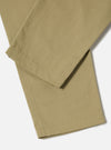 Close-up of the Sand Twill Curved Pant on a white background. The sand-colored twill fabric shows a subtle texture and clean lines.