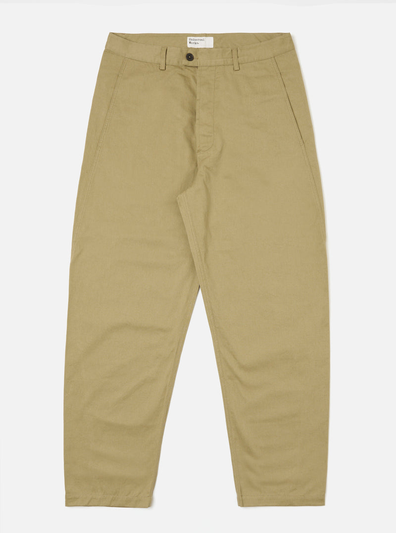 The Sand Twill Curved Pant in sand color, laid flat on a white background. The pants are made of twill fabric and have a curved fit.