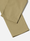 Close-up of the Sand Twill Aston Pant on a white background. The twill fabric has a subtle texture and a tailored fit.
