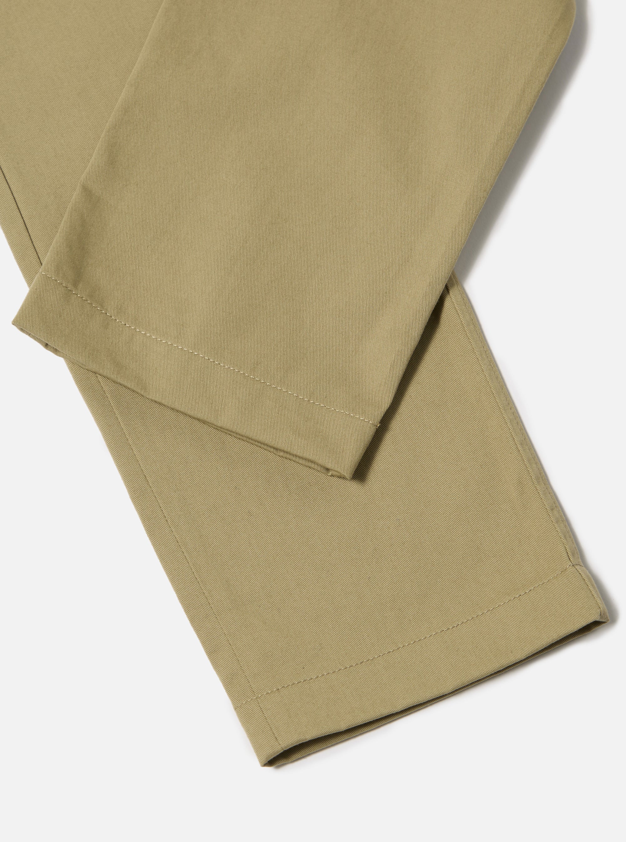 Close-up of the Sand Twill Aston Pant on a white background. The twill fabric has a subtle texture and a tailored fit.