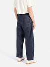 Back view of a model wearing Indigo 13oz Selvedge Denim Duke Pant, a dark wash, wide-leg jean.  Shot in a studio with a white background.