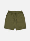 The Light Olive Twill Beach Short is shown as a flat lay against a plain white background. The shorts feature an elasticated waistband with a contrasting off-white drawstring, two front slant pockets, and a mid-thigh length. The garment is made from a solid light olive green cotton twill fabric.