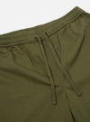The Light Olive Twill Beach Short is shown from the back, highlighting the two rear patch pockets and the elasticated waistband. The shorts are displayed as a flat lay against a plain white background.