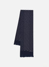 Close-up of a Navy Dot Print Short Scarf on a white surface. The scarf is navy with small white dots and has a fringed edge.