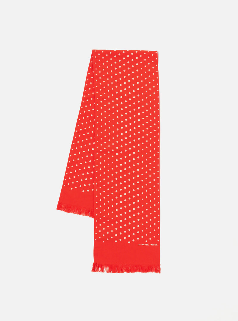 The Orange Dot Print Short Scarf on a white background. The scarf is red with white dots and has a fringed edge.