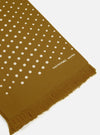 Close-up of the Mustard Dot Print Short Scarf on a white surface. The scarf is mustard-colored with white dots and a fringed edge. "universal works" is printed on the scarf.