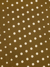 Close-up of a Mustard Dot Print Short Scarf. The scarf has a mustard background with white polka dots. The fabric is flat and evenly lit.