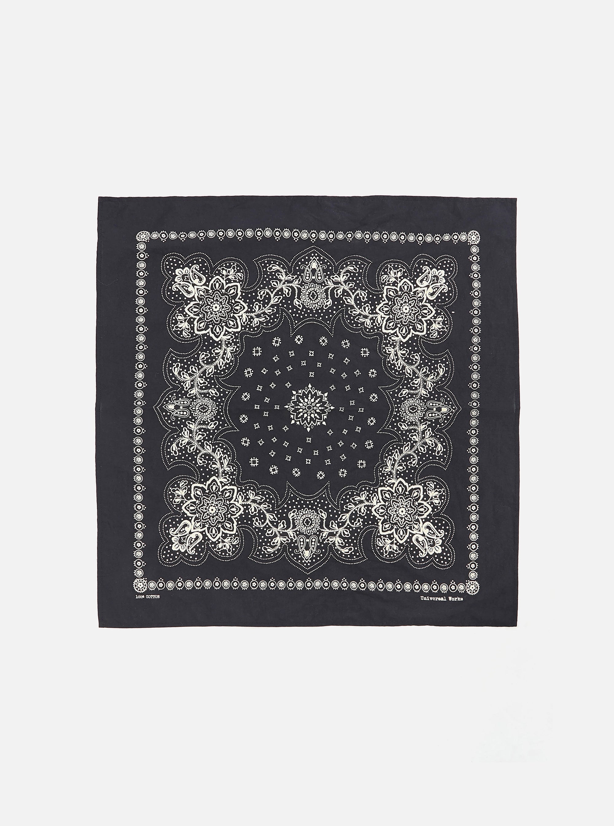 Flat lay of a Black Classic Bandana Neckerchief on a white background. The bandana has a white floral pattern.