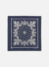 Flat lay of a Navy Classic Bandana Neckerchief on a white background. The bandana is navy with a white floral pattern. 100% cotton.