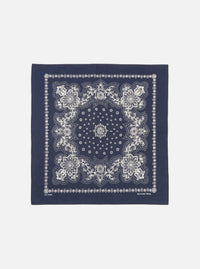 Flat lay of a Navy Classic Bandana Neckerchief on a white background. The bandana is navy with a white floral pattern. 100% cotton.