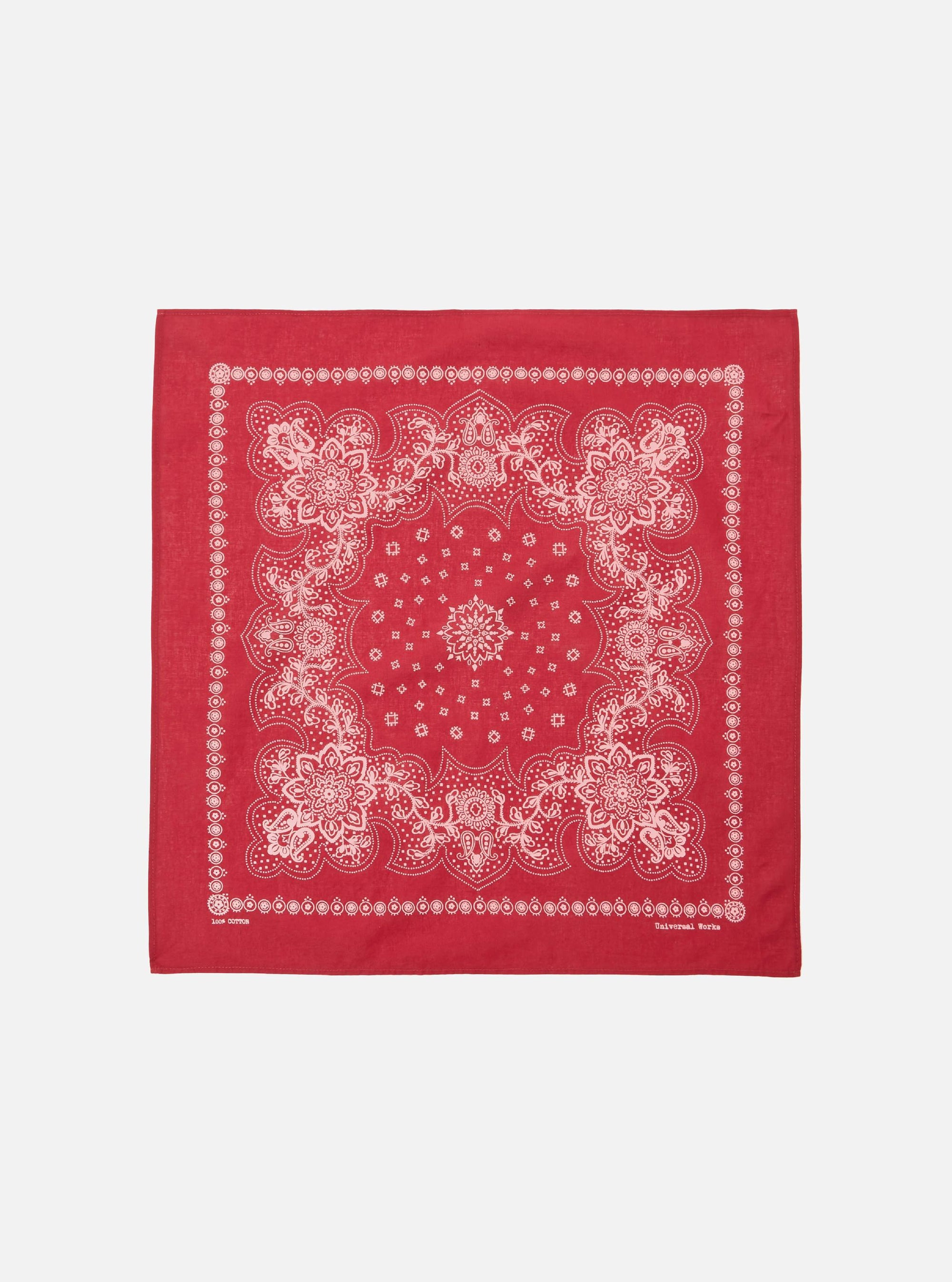 The Red Classic Bandana Neckerchief, a square of red cotton with a white paisley pattern, is displayed on a white background.