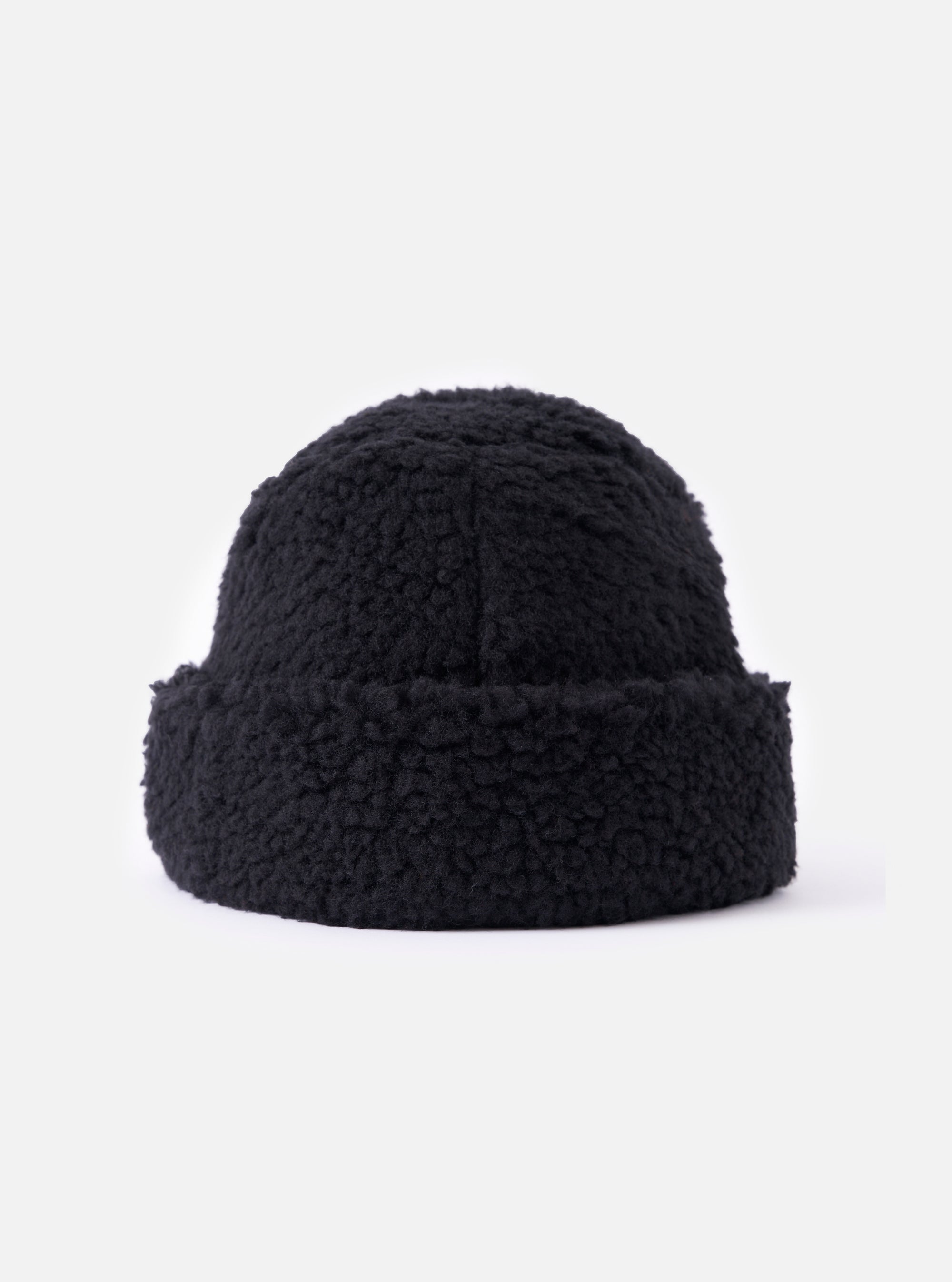 Close-up of the cableami® Black Toque Boa Cap on a white background. The black, textured hat has a rounded shape and a slight brim.