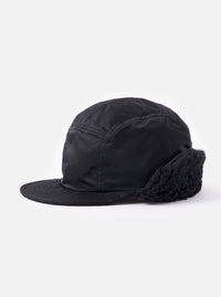 Side view of the cableami® Black Military Nylon Twill Cap on a white background. The cap is black nylon with ear flaps.