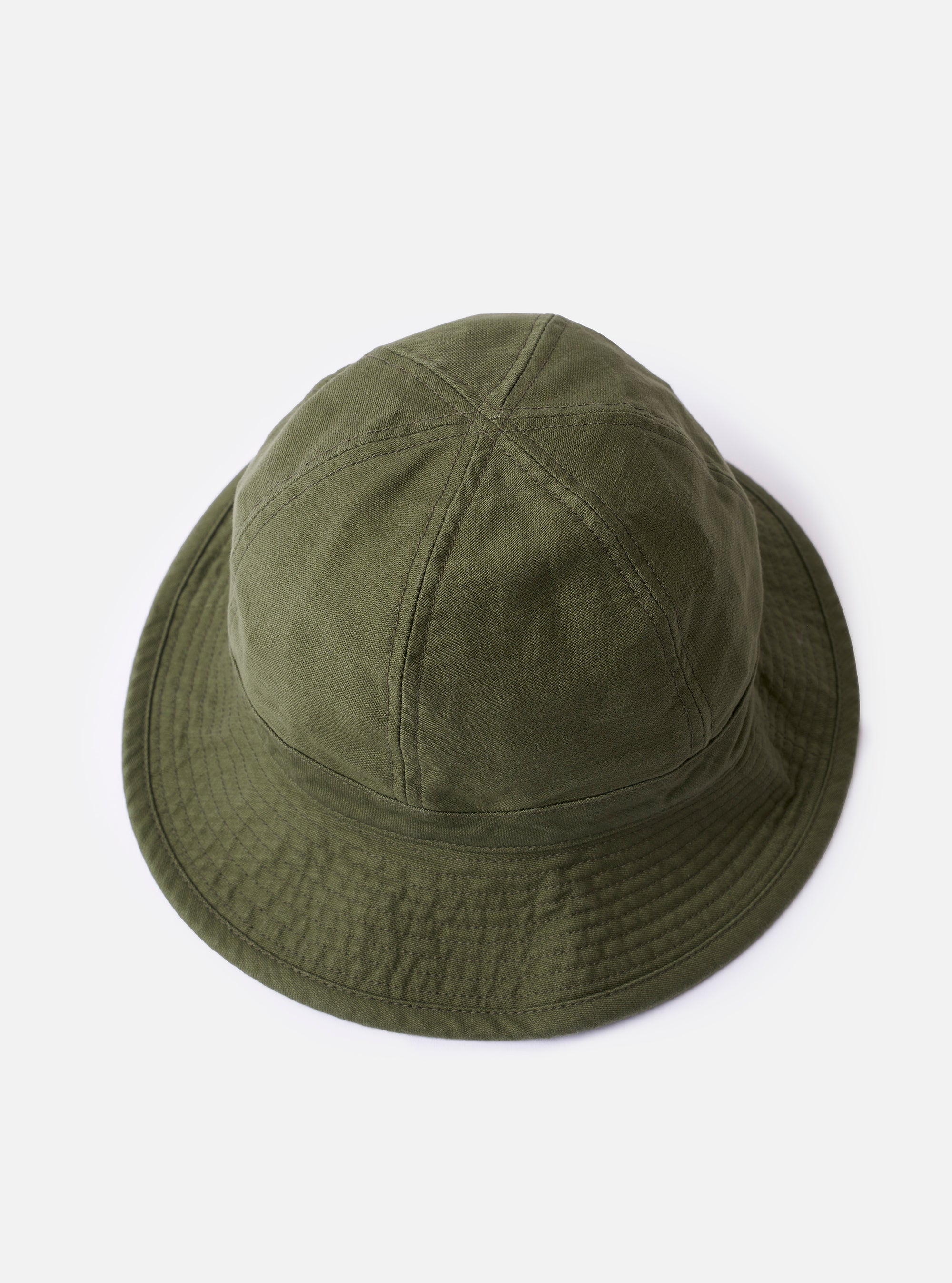 The cableami Dark Olive Baker Back Satin Cotton Metro Hat is shown from the back as a flat lay against a plain white background. The image highlights the rounded crown construction with visible vertical seams and the downward-sloping brim. The dark olive green fabric has a subtle textured back satin finish.