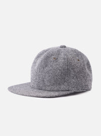 cableami® Black/White Recycled Tweed Cap on a white background. The cap is made of black and white tweed and has a classic fit.