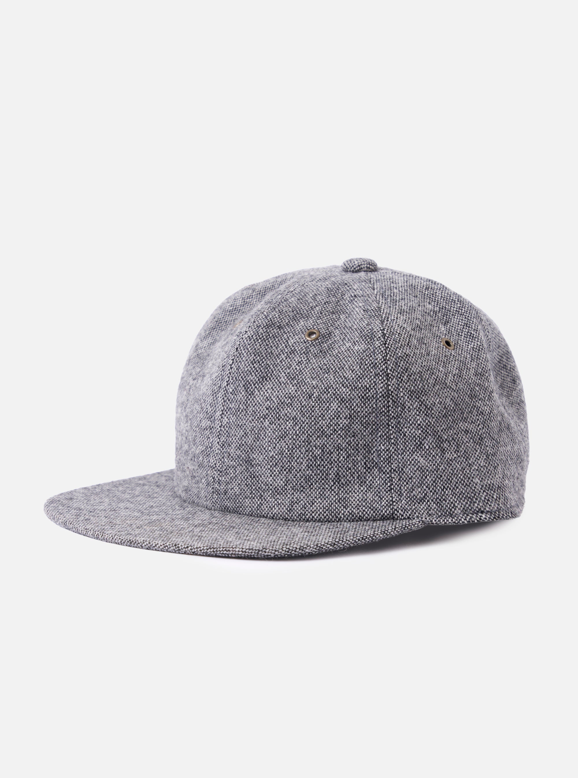 cableami® Black/White Recycled Tweed Cap on a white background. The cap is made of black and white tweed and has a classic fit.