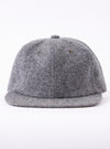 cableami® Black/White Recycled Tweed Cap on a white background. The cap is made of black and white tweed and has a classic fit.
